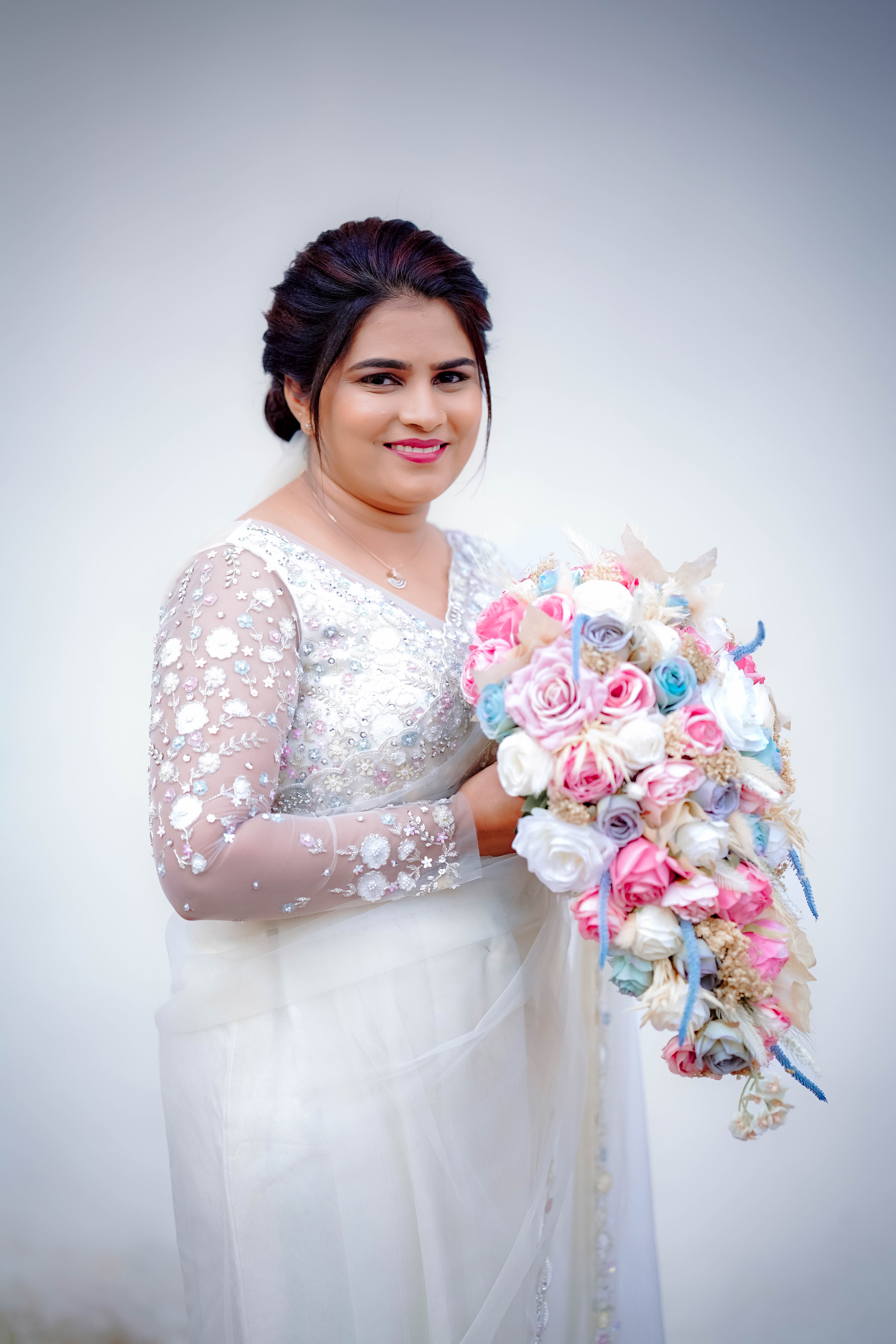 Elegant bride sitting in traditional setup - The Photocrafters